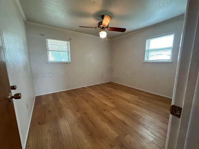a bathroom with a granite countertop toilet sink and shower