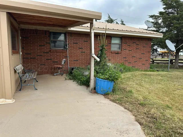 a view of swimming pool with outdoor seating and deck