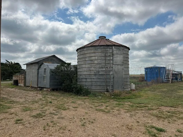a view of a swimming pool with a yard