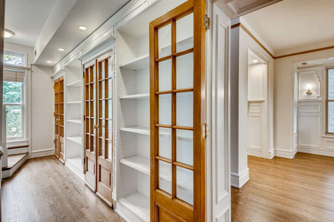 1429 West Roscoe Street Chicago, IL 60657 - Photo 13 of 65 a view of entryway with wooden floor and door