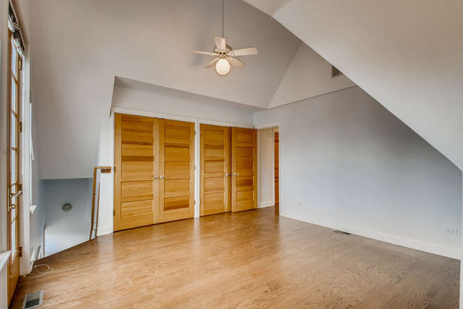 1429 West Roscoe Street Chicago, IL 60657 - Photo 17 of 65 an empty room with a empty space and windows