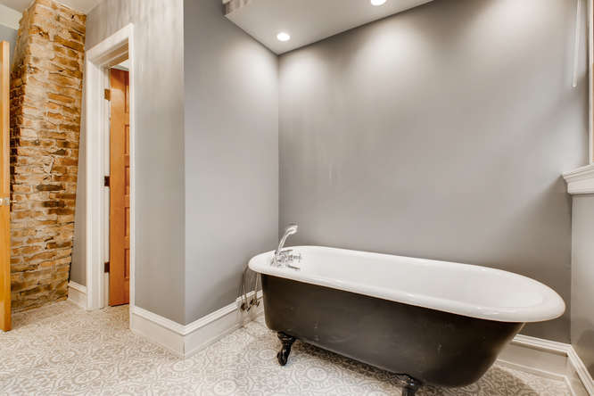 1429 West Roscoe Street Chicago, IL 60657 - Photo 19 of 65 a bathroom with a sink and a toilet