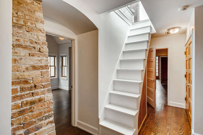 1429 West Roscoe Street Chicago, IL 60657 - Photo 23 of 65 a view of walk in closet with empty racks