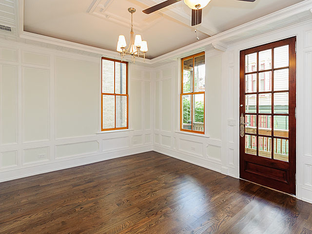 1429 West Roscoe Street Chicago, IL 60657 - Photo 28 of 65 a view of an empty room with wooden floor and a window
