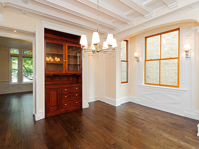 1429 West Roscoe Street Chicago, IL 60657 - Photo 30 of 65 an empty room with wooden floor closet and windows