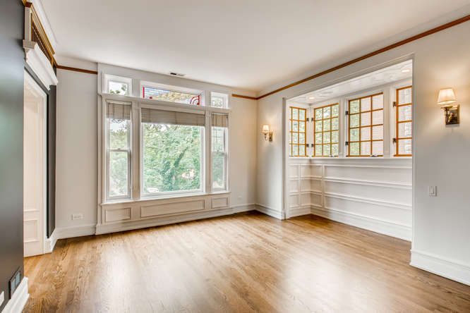 1429 West Roscoe Street Chicago, IL 60657 - Photo 3 of 65 wooden floor in an empty room with a window
