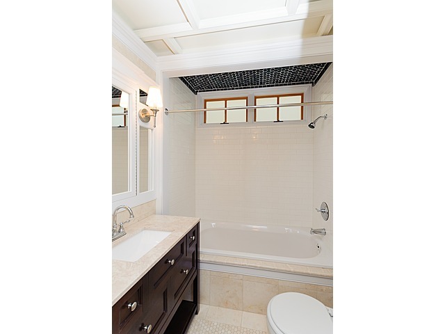 1429 West Roscoe Street Chicago, IL 60657 - Photo 36 of 65 a bathroom with a granite countertop sink toilet and shower