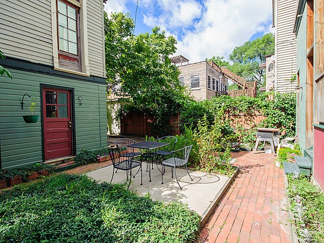 1429 West Roscoe Street Chicago, IL 60657 - Photo 39 of 65 a view of house with backyard outdoor seating and plants