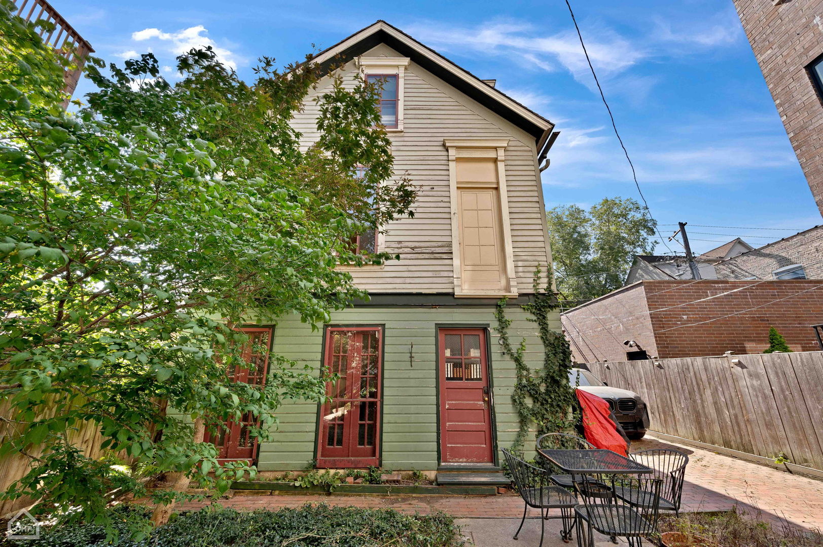 1429 West Roscoe Street Chicago, IL 60657 - Photo 41 of 65 a view of a house with a yard