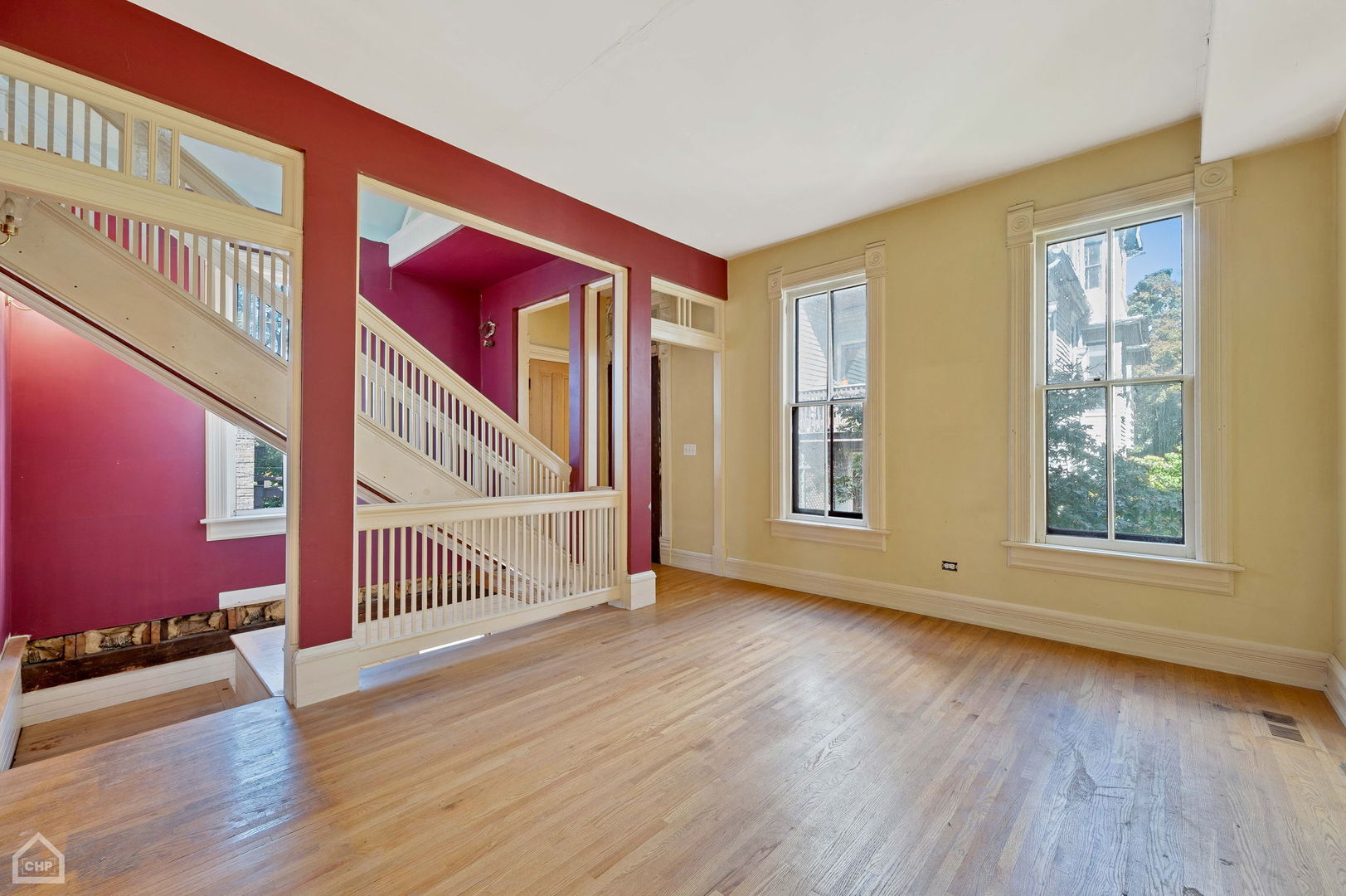 1429 West Roscoe Street Chicago, IL 60657 - Photo 42 of 65 a view of an empty room with wooden floor and windows