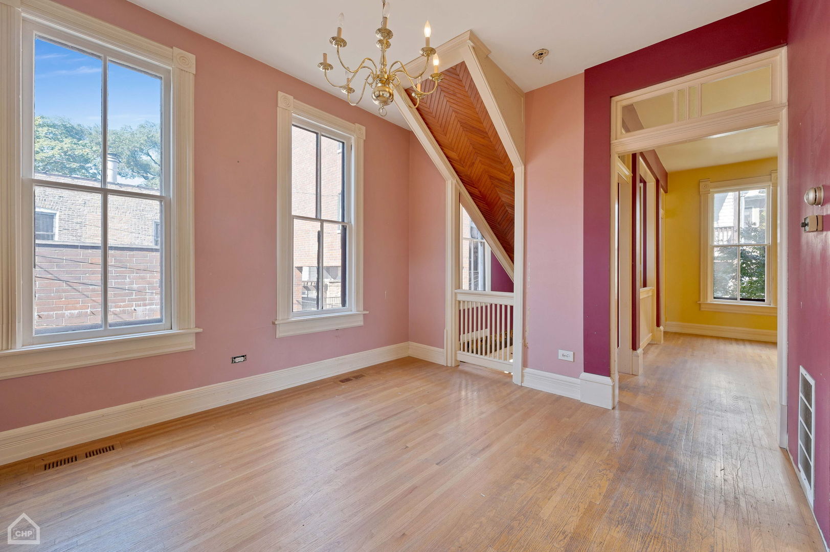 1429 West Roscoe Street Chicago, IL 60657 - Photo 44 of 65 a view of an entryway with wooden floor and windows
