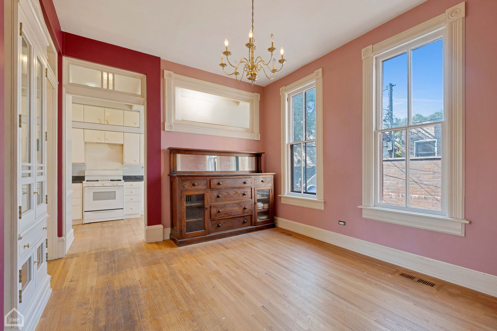1429 West Roscoe Street Chicago, IL 60657 - Photo 45 of 65 an empty room with windows and cabinet