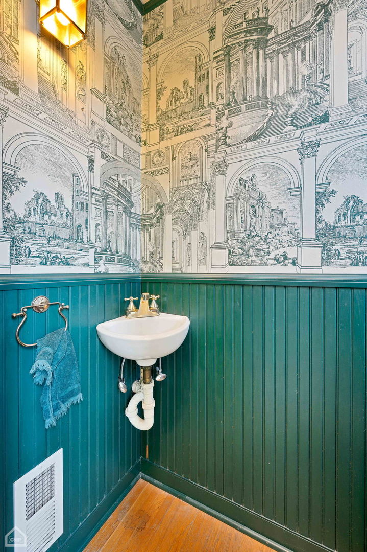 1429 West Roscoe Street Chicago, IL 60657 - Photo 46 of 65 a bathroom with a sink a mirror and a bathtub