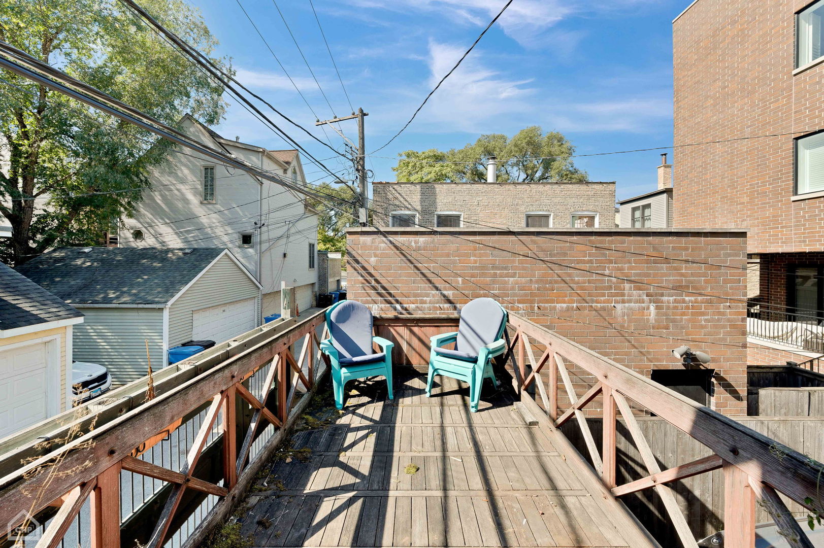 1429 West Roscoe Street Chicago, IL 60657 - Photo 51 of 65 a balcony view with couple of chairs