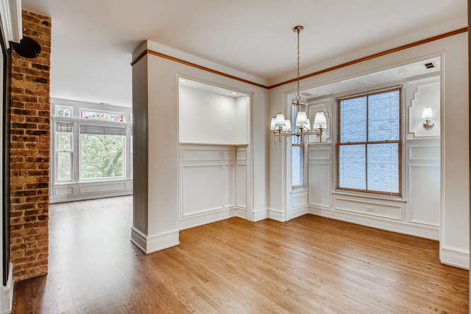 1429 West Roscoe Street Chicago, IL 60657 - Photo 6 of 65 a view of a room with wooden floor and entryway
