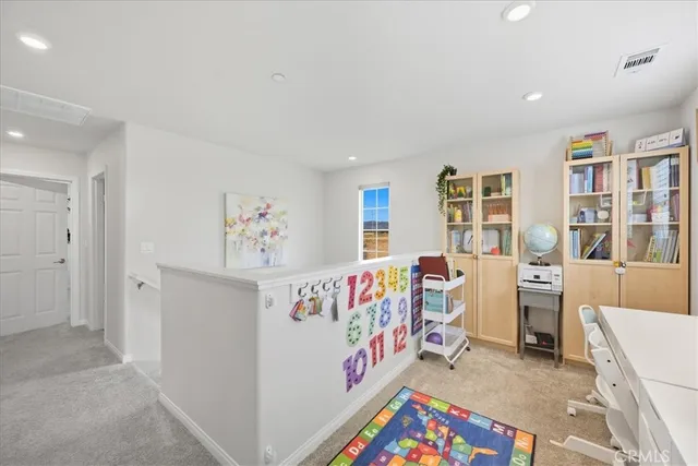 a bedroom with furniture and white walls