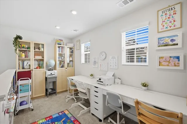 a bedroom with bed and window