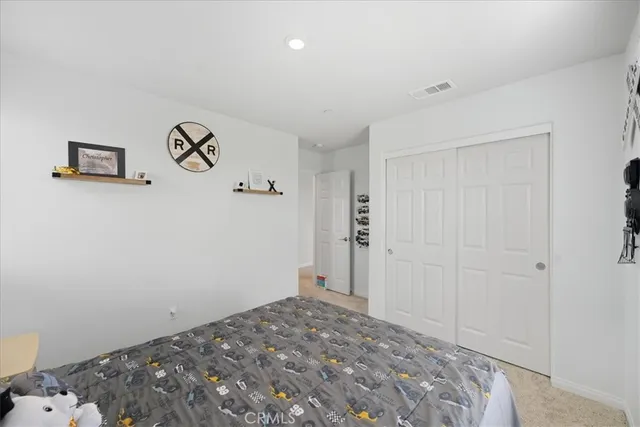 a bathroom with double vanity sinks and a mirror