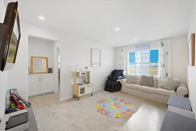 a living room with furniture and a couch