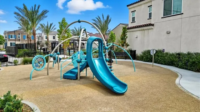 a swimming pool with outdoor seating and yard