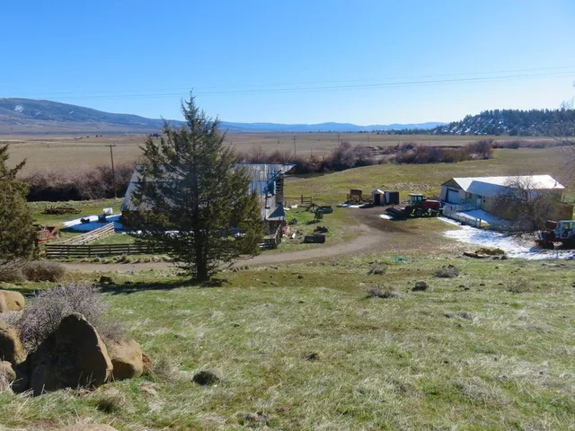 a view of a lake with houses in the back