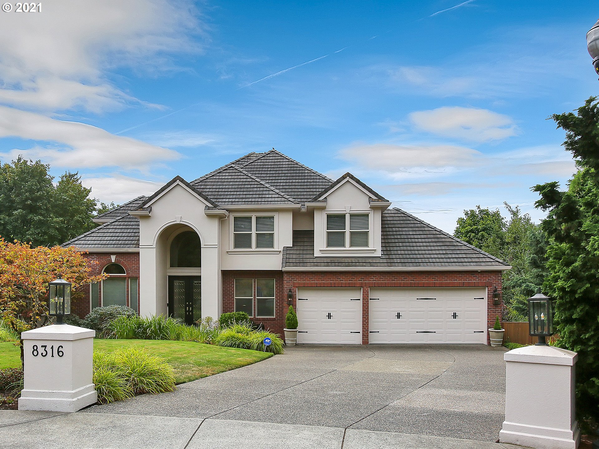 8316 Northwest Ridgetop Court Portland, OR 97229 - Photo 1 of 32 a front view of a house with a yard