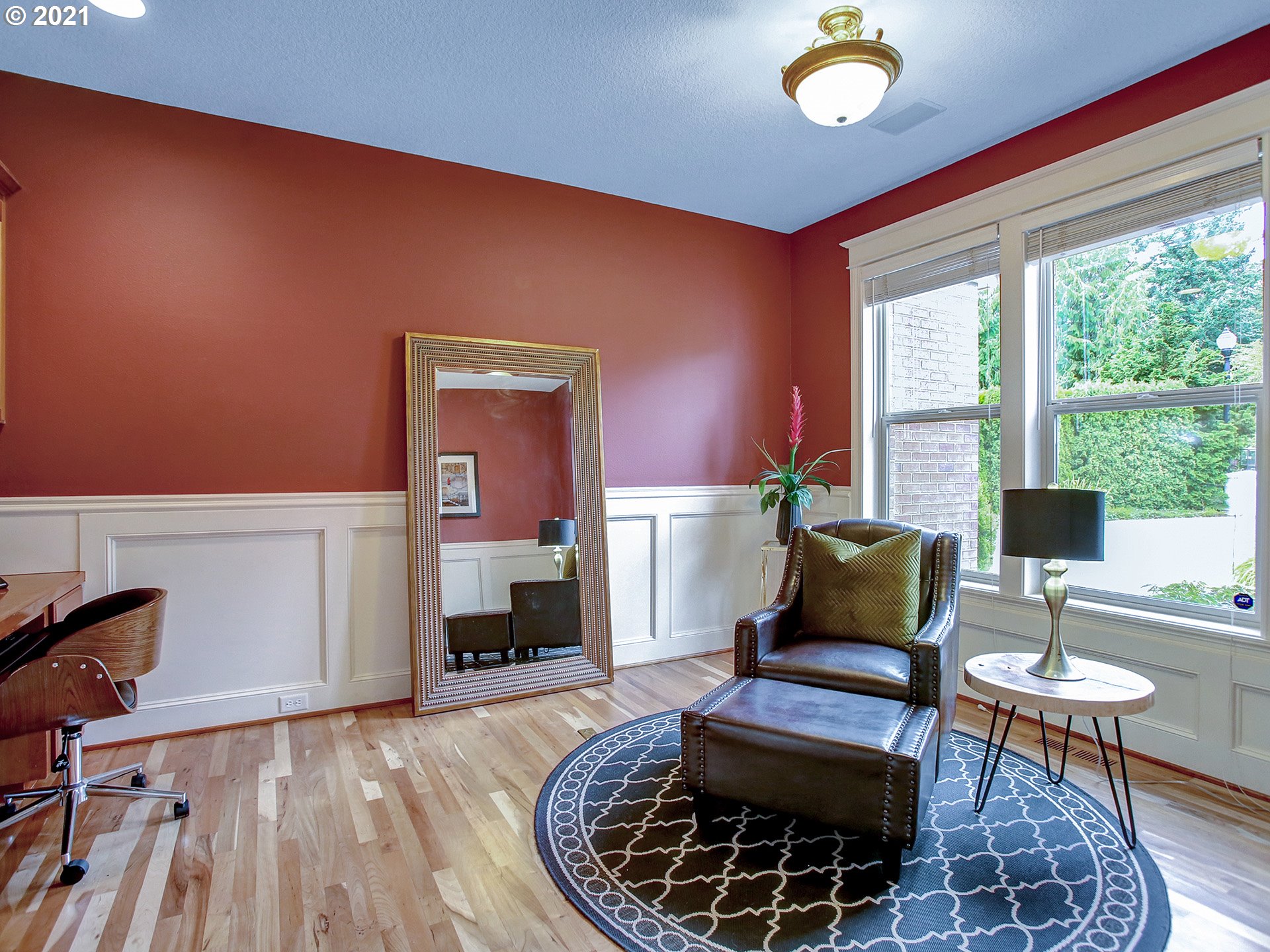 8316 Northwest Ridgetop Court Portland, OR 97229 - Photo 12 of 32 a living room with furniture and a fireplace