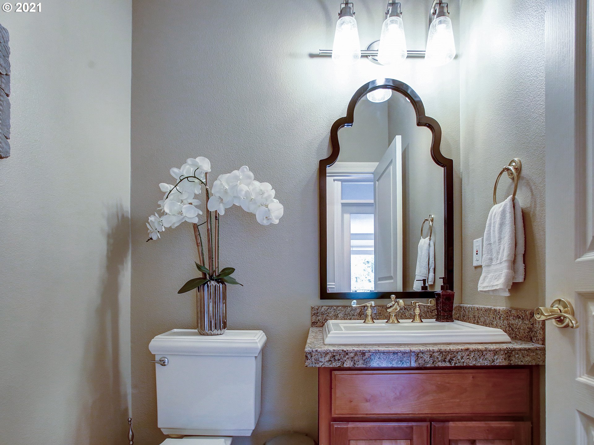 8316 Northwest Ridgetop Court Portland, OR 97229 - Photo 13 of 32 a bathroom with a double vanity sink and a mirror