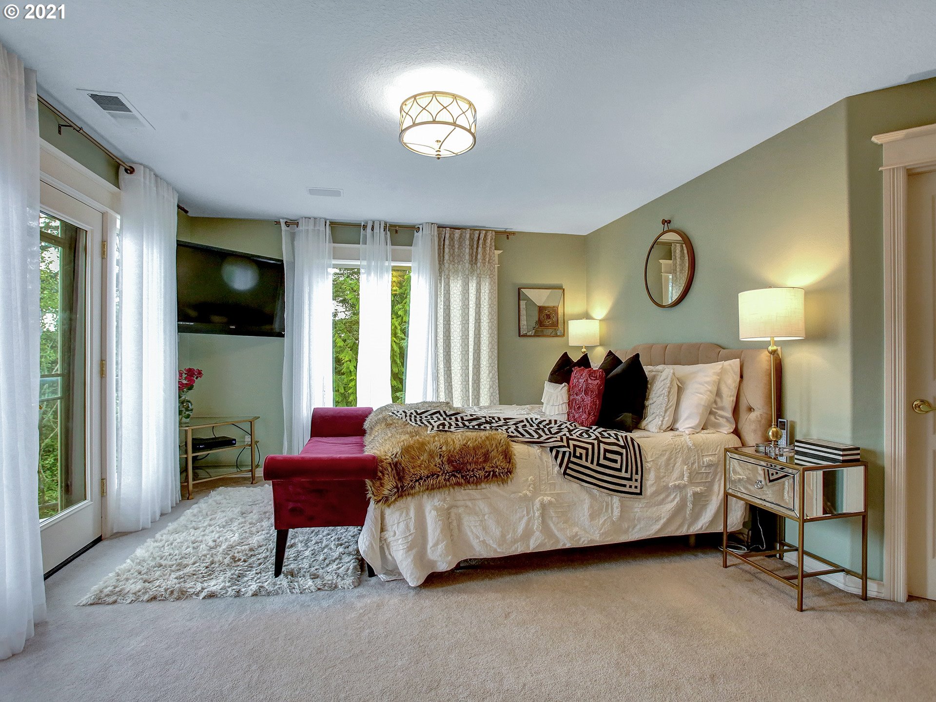 8316 Northwest Ridgetop Court Portland, OR 97229 - Photo 15 of 32 a bed room with a bed and a lamp