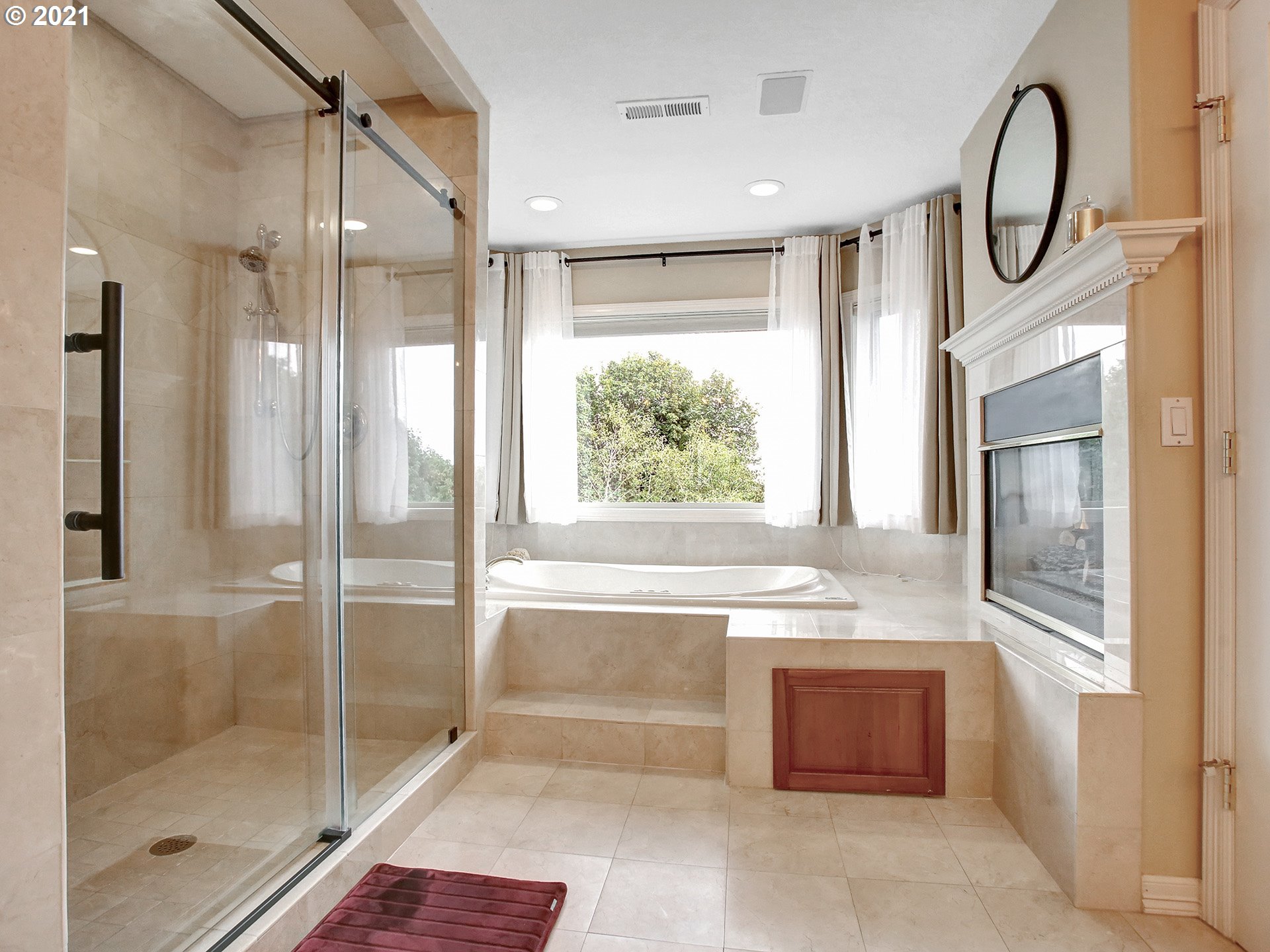 8316 Northwest Ridgetop Court Portland, OR 97229 - Photo 18 of 32 a bathroom with a large tub shower and sink