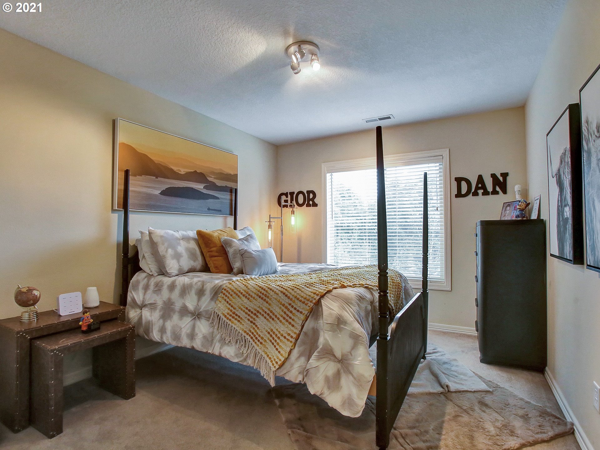8316 Northwest Ridgetop Court Portland, OR 97229 - Photo 20 of 32 a bedroom with a bed and a refrigerator
