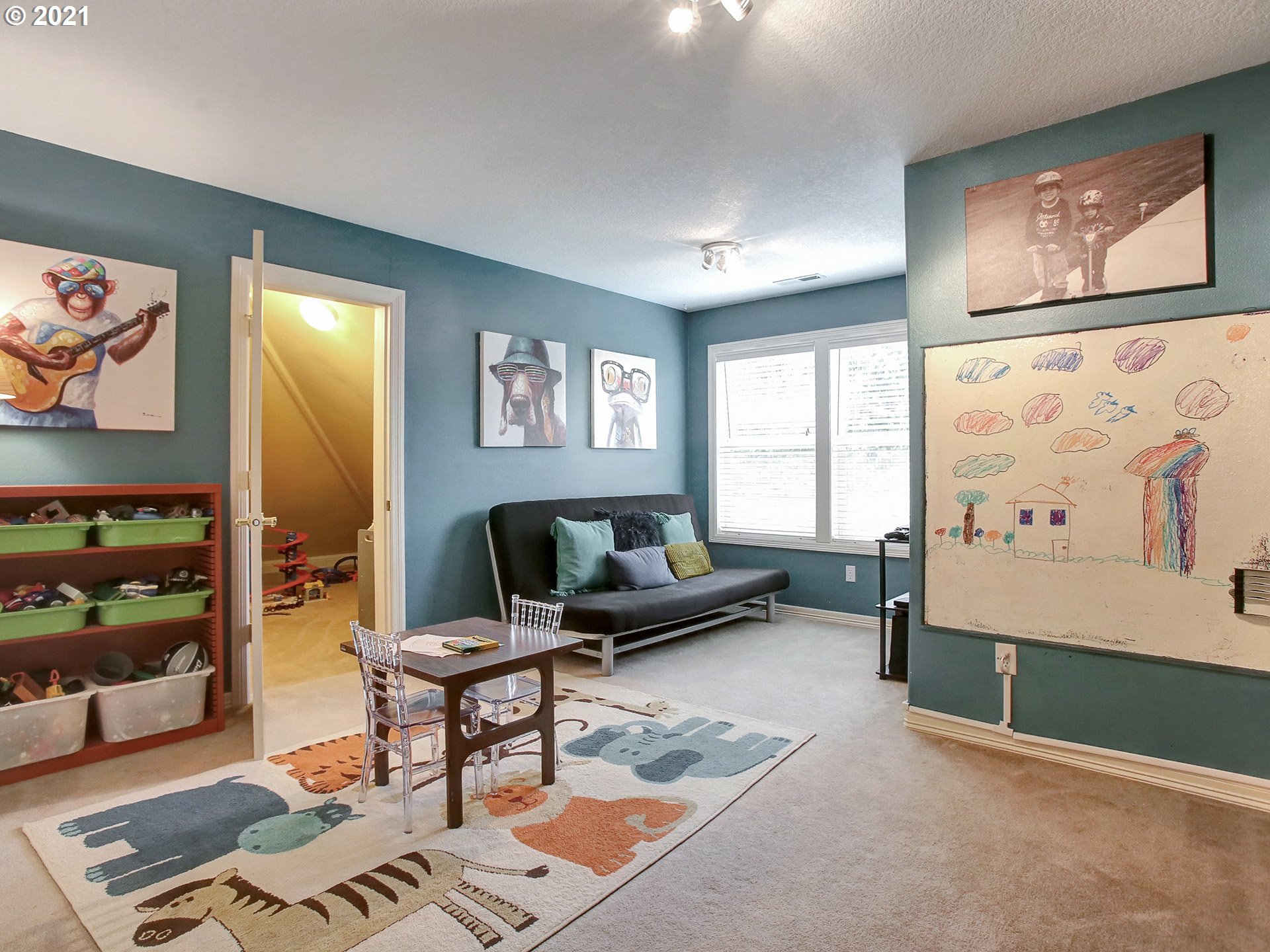 8316 Northwest Ridgetop Court Portland, OR 97229 - Photo 22 of 32 a living room with furniture and window
