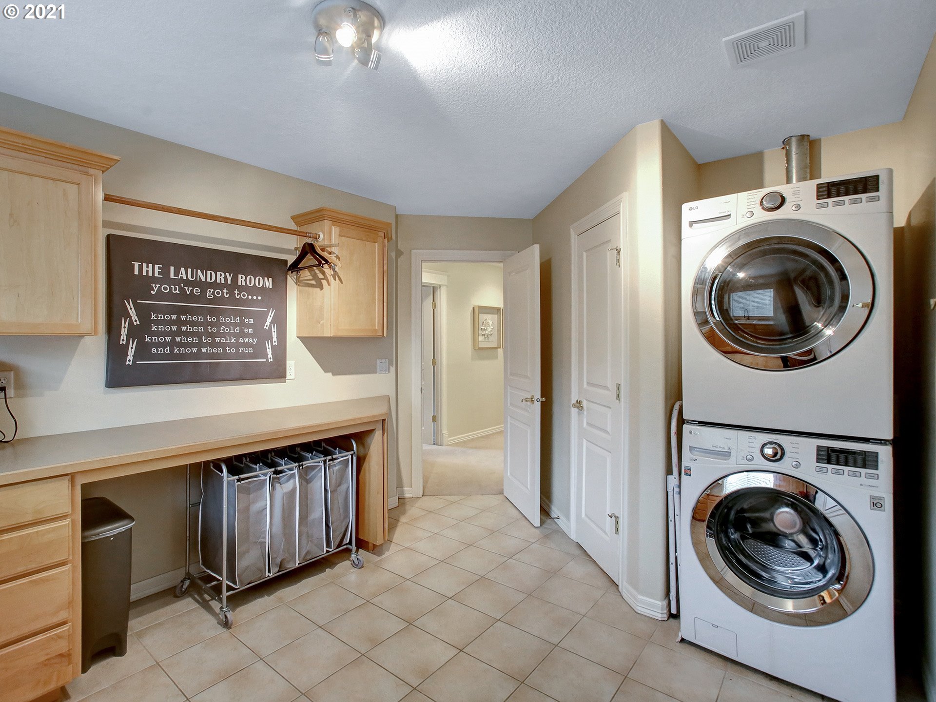 8316 Northwest Ridgetop Court Portland, OR 97229 - Photo 23 of 32 a view of a hallway with washer and dryer