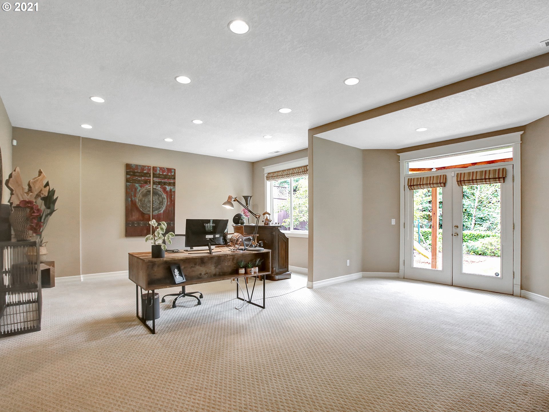 8316 Northwest Ridgetop Court Portland, OR 97229 - Photo 27 of 32 a living room with furniture and a large window