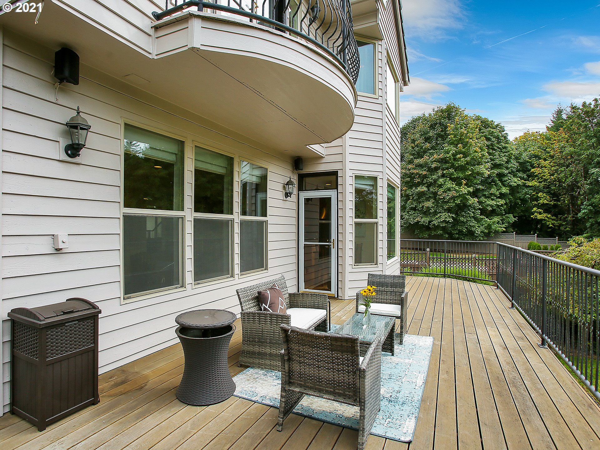 8316 Northwest Ridgetop Court Portland, OR 97229 - Photo 28 of 32 a balcony with furniture and wooden floor
