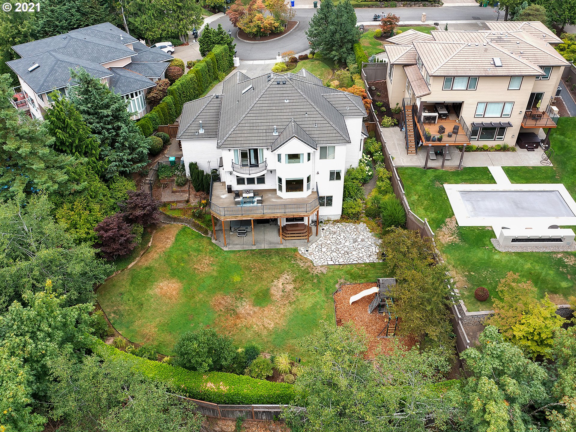 8316 Northwest Ridgetop Court Portland, OR 97229 - Photo 30 of 32 an aerial view of a house with swimming pool patio and outdoor seating
