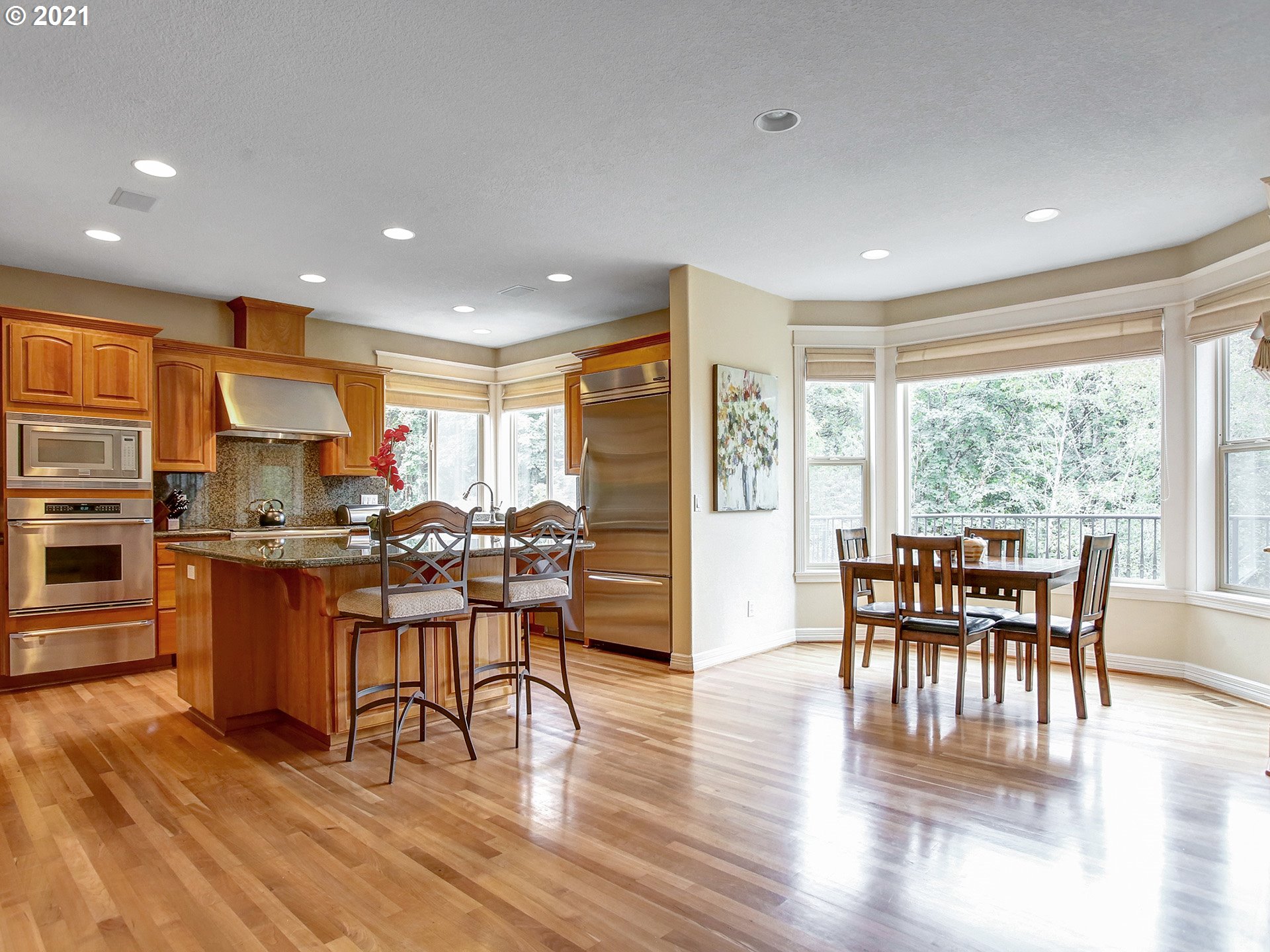 8316 Northwest Ridgetop Court Portland, OR 97229 - Photo 7 of 32 a view of a dining room with furniture window and wooden floor
