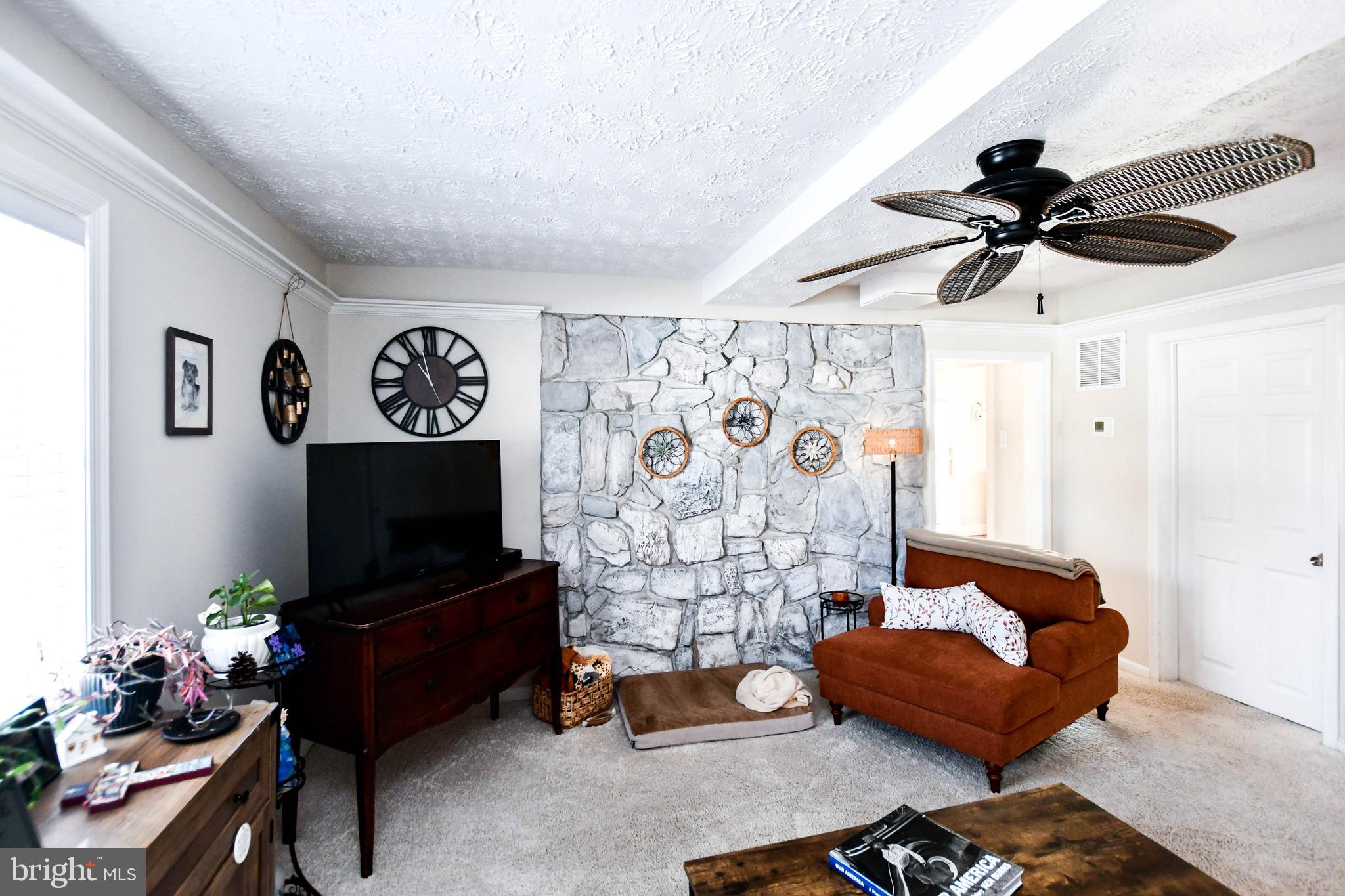 823 Selby Boulevard Edgewater, MD 21037 - Photo 12 of 40 a living room with furniture and a flat screen tv