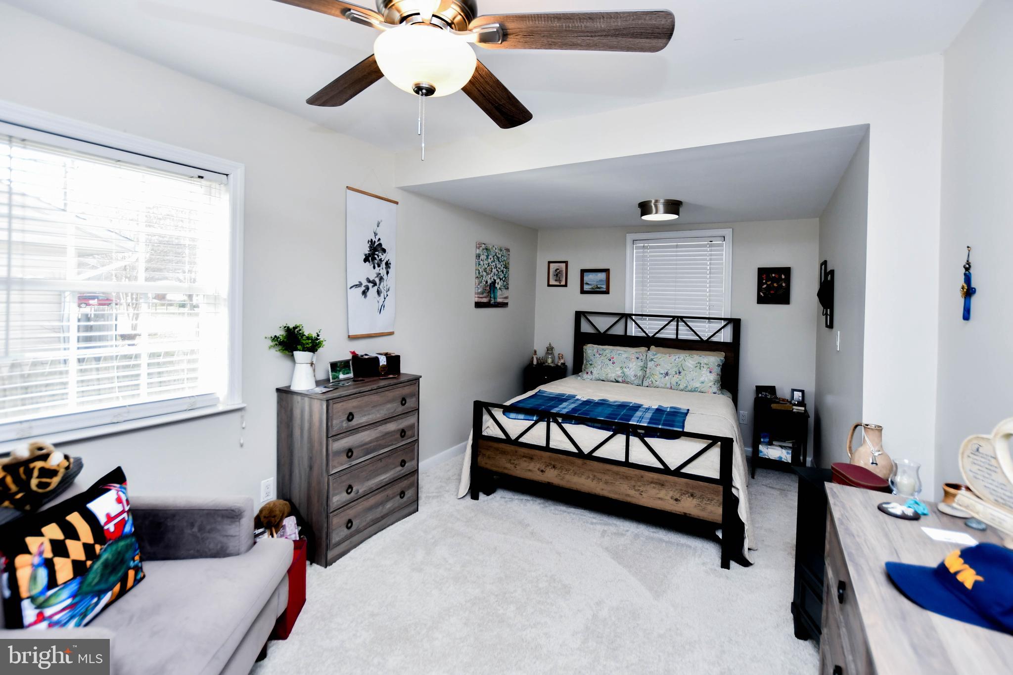 823 Selby Boulevard Edgewater, MD 21037 - Photo 13 of 40 a bedroom with a bed and a window