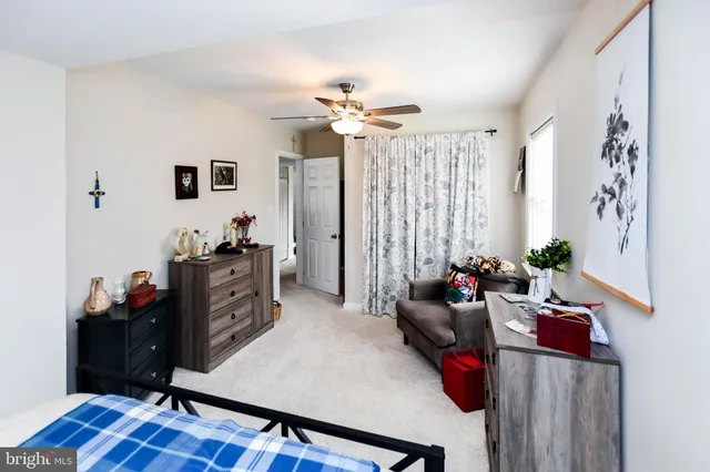a kitchen with granite countertop a sink cabinets stainless steel appliances and a window