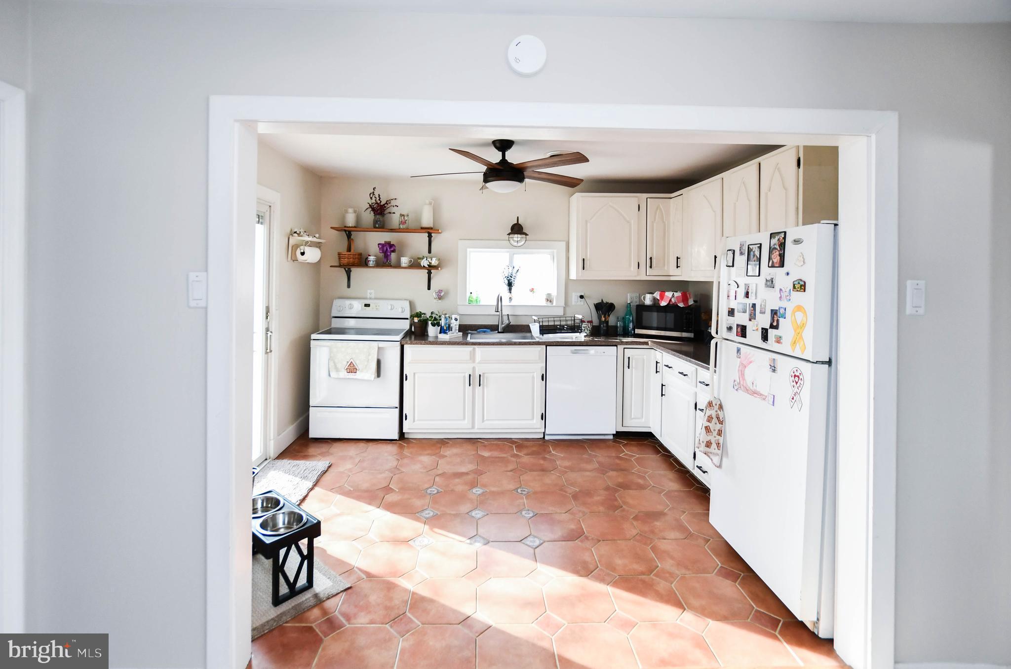 823 Selby Boulevard Edgewater, MD 21037 - Photo 15 of 40 a kitchen with granite countertop a sink cabinets stainless steel appliances and a window