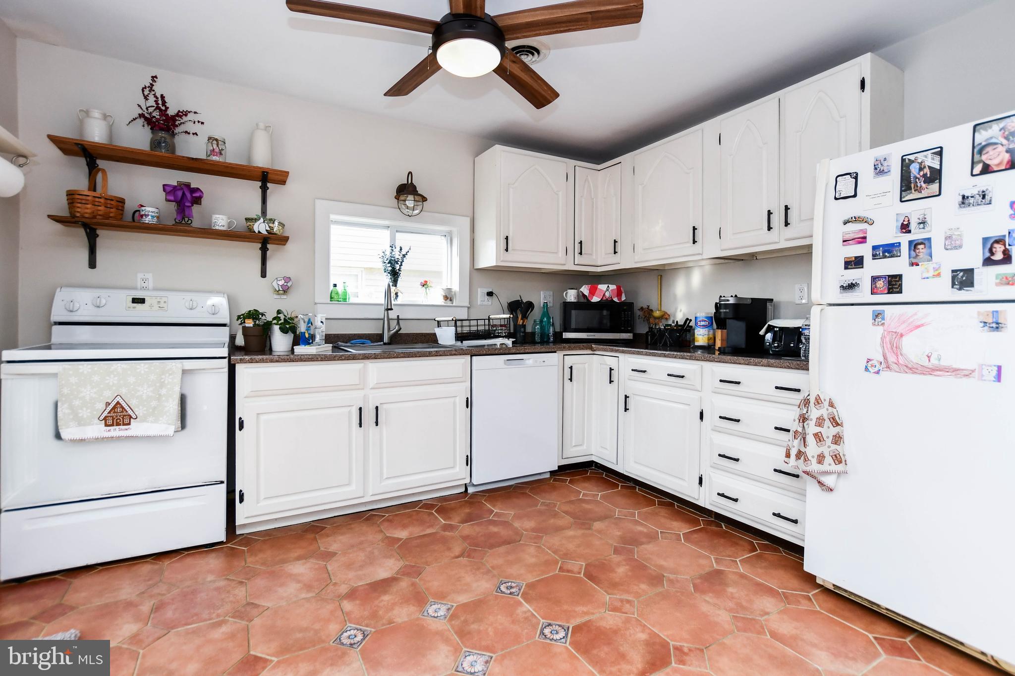 823 Selby Boulevard Edgewater, MD 21037 - Photo 16 of 40 a kitchen with white cabinets and white appliances