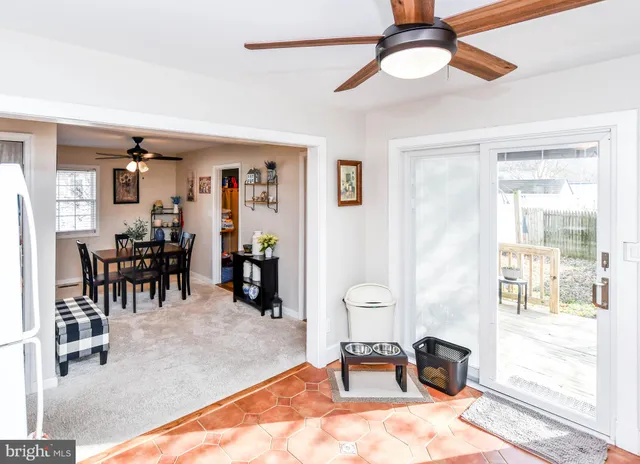 a view of a livingroom with furniture and entryway