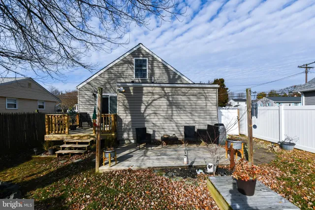 a view of a backyard with sitting area