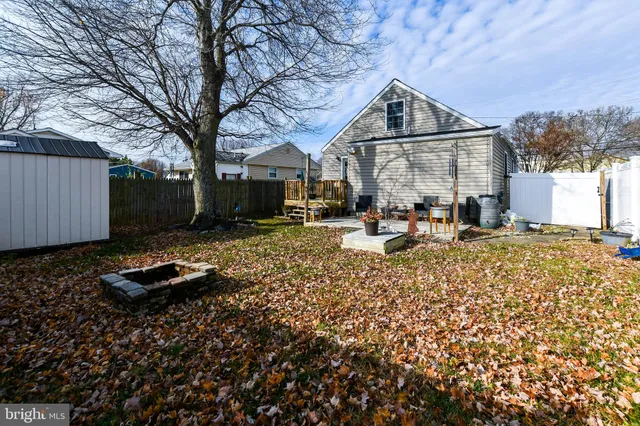 a view of a swimming pool with an outdoor seating and a yard