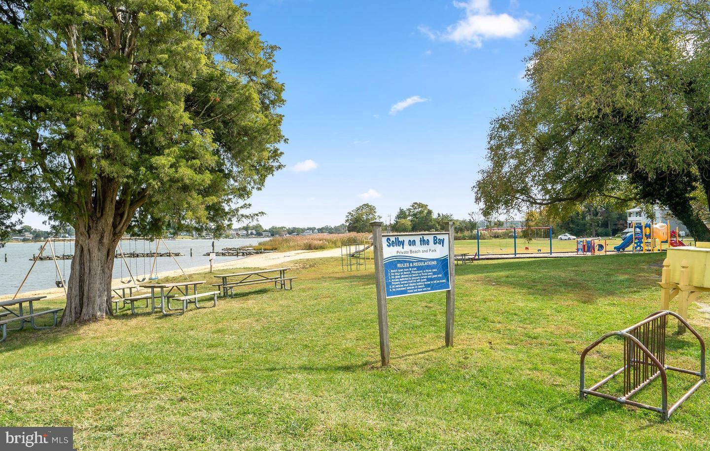 823 Selby Boulevard Edgewater, MD 21037 - Photo 34 of 40 a view of a swimming pool with an outdoor seating and a yard