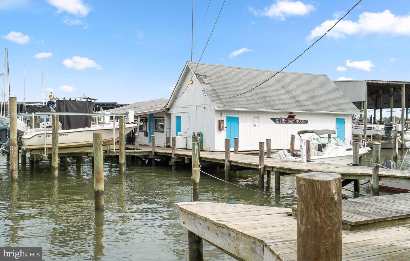 823 Selby Boulevard Edgewater, MD 21037 - Photo 36 of 40 a dining room with lots of wooden furniture and a table