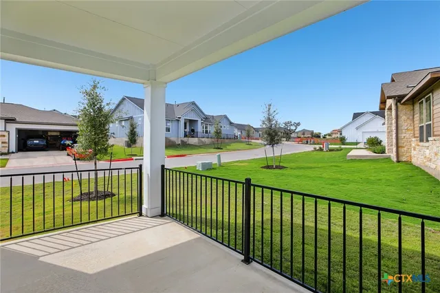 a view of a garden and deck