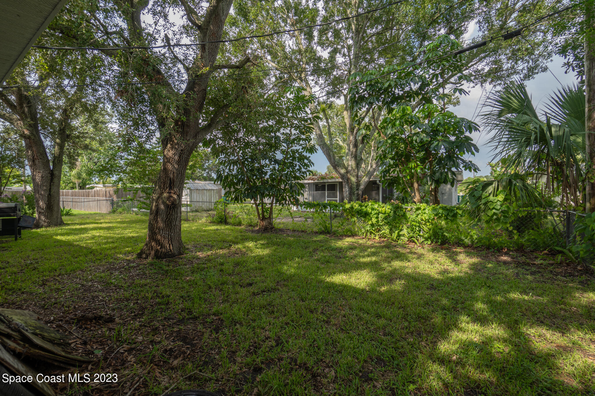 265 Lee Road Melbourne, FL 32904 - Photo 9 of 10 a view of green field with trees