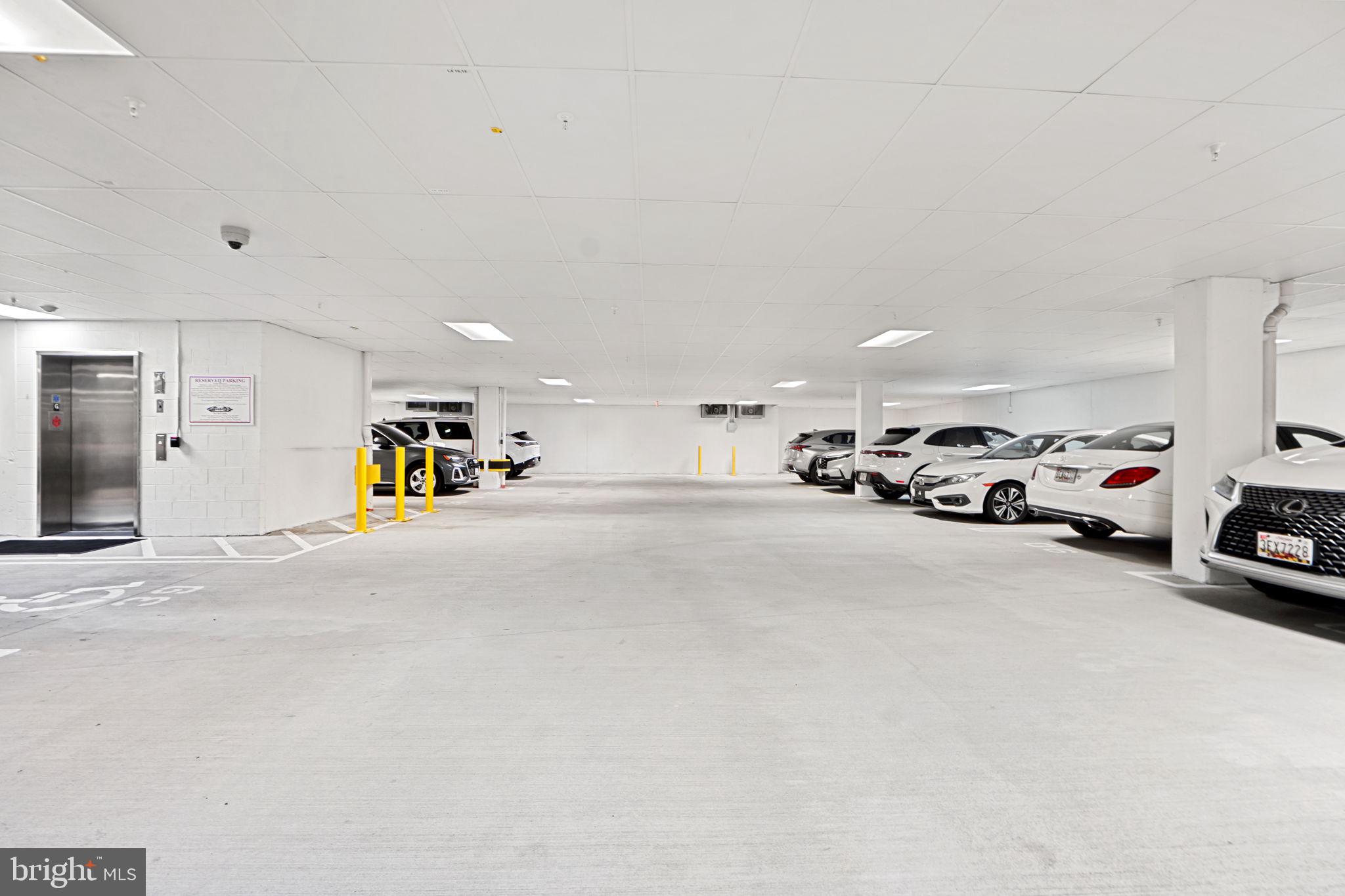 210 Decoverly Drive, Unit 106 Gaithersburg, MD 20878 - Photo 32 of 59 a view of parking area with a car parked in front of it